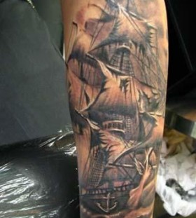 Black pirates ship tattoo on arm