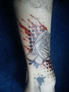 Black rose origami tattoo on leg