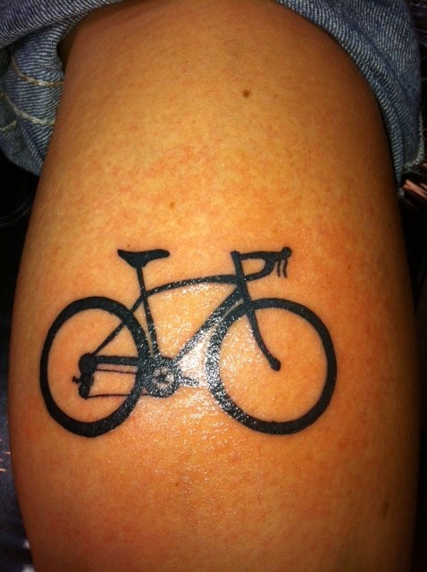 Black simple bicycle tattoo on leg