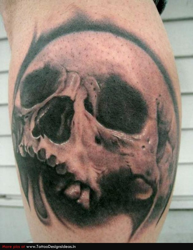 Black simple skull tattoo on leg