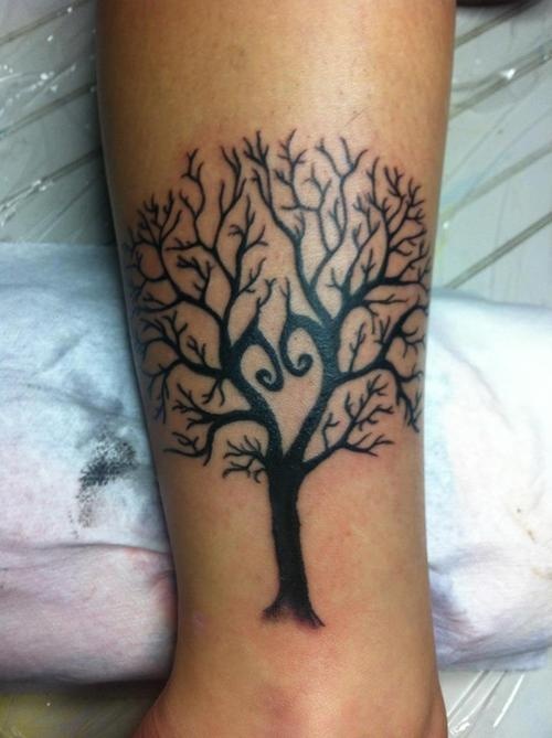 Black simple tree tattoo on leg