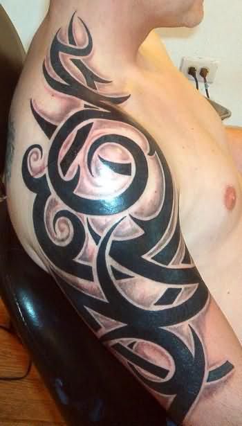 Black simple tribal tattoo on shoulder