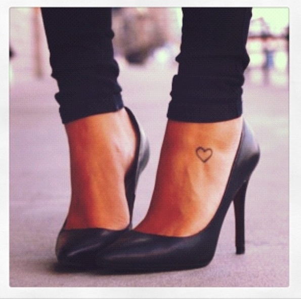 Black women’s high-heels and heart tattoo