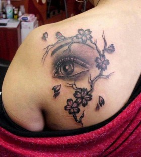 Blossom cherry eye tattoo on shoulder