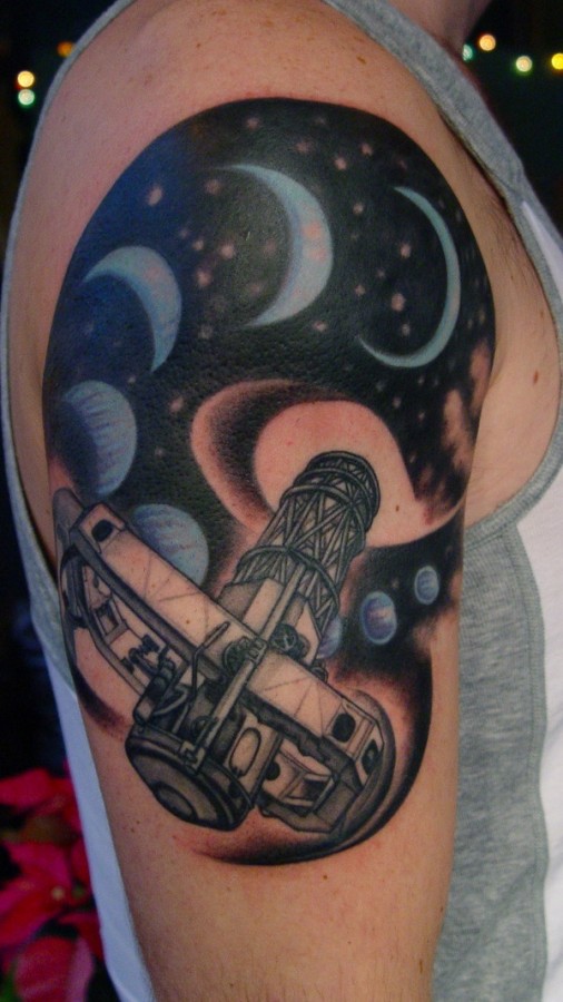 Blue adorable moon tattoo on shoulder