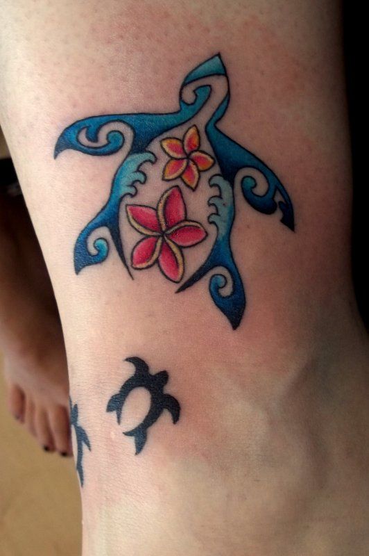 Blue and red hawaiian style tattoo