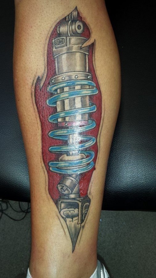 Blue auto car tattoo on leg