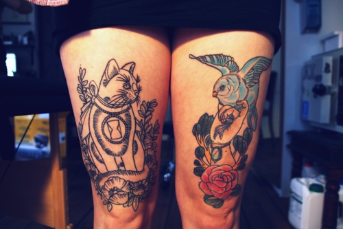 Blue bird and cat tattoo on leg