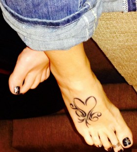 Blue jeans and heart tattoo