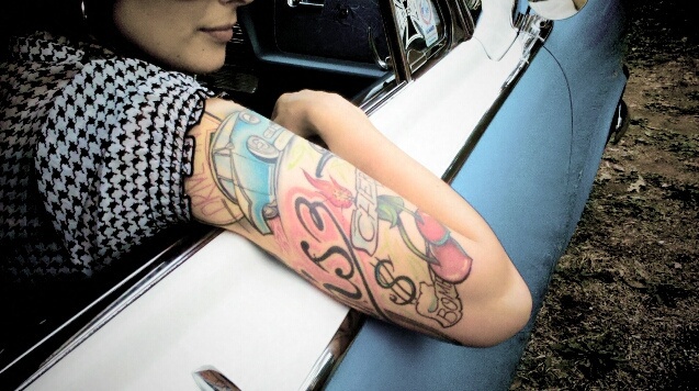 Blue lovely car tattoo on arm