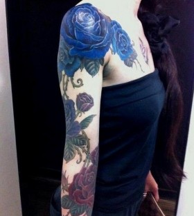 Blue lovely rose tattoo on arm