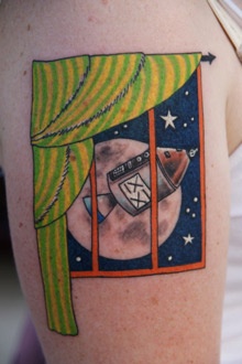 Blue star and window moon tattoo on shoulder