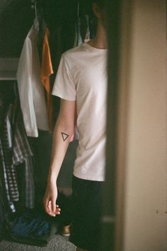 Boy with triangle tattoo