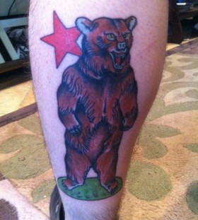 Brown bear and red star tattoo