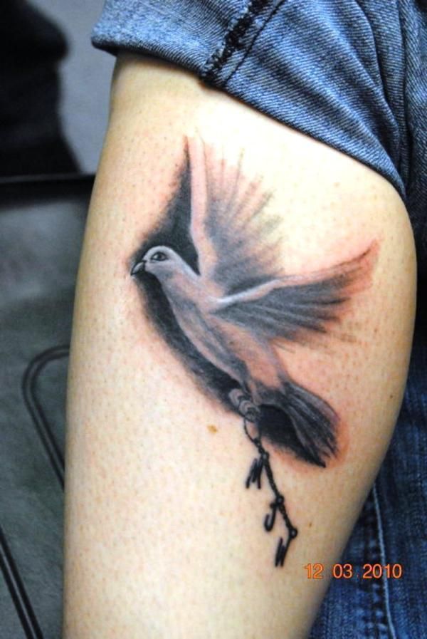 Brown lovely bird tattoo on leg