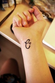 C letter tattoo on hand