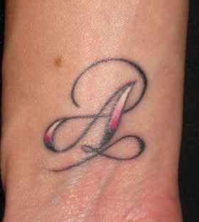 Colorful A letter tattoo on wrist