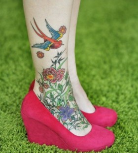 Colorful bird and flowers tattoo with shoes