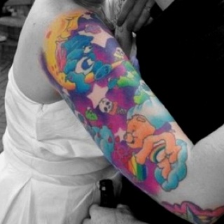 Colorful pretty bear tattoo on arm