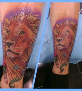 Colorful pretty lion tattoo on leg