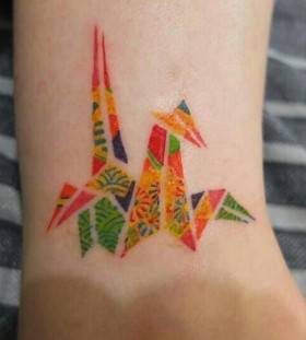 Colorful simple origami tattoo on leg