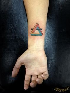 Colorful triangle tattoo