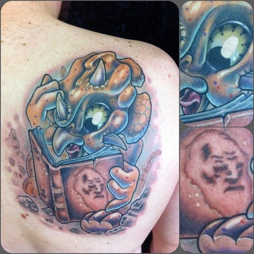 Cruel blue back book tattoo