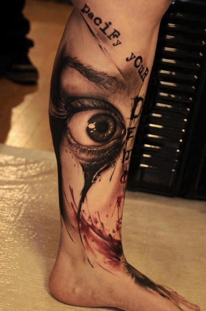 Cruel men’s eye tattoo on leg