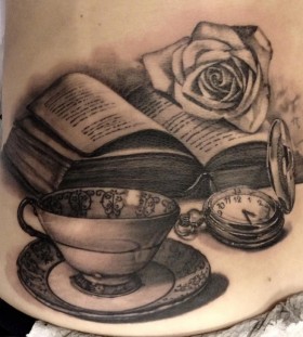 Cup, rose and back book tattoo