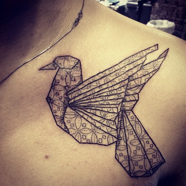 Cute black bird origami tattoo on shoulder