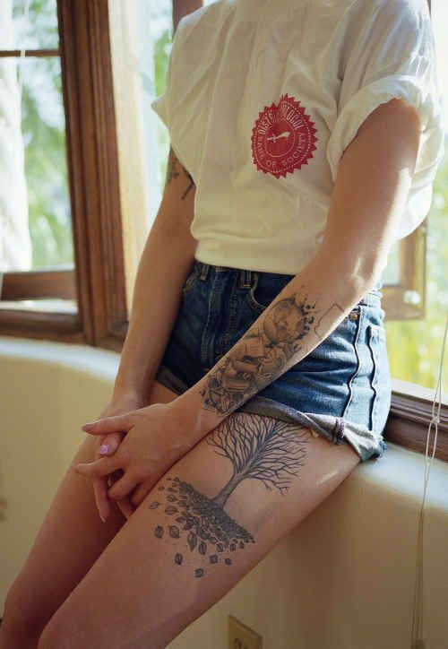 Cute black tree tattoo on leg