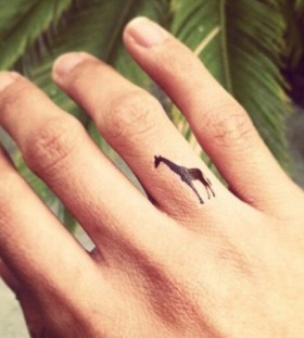 Cute giraffer tattoo on finger
