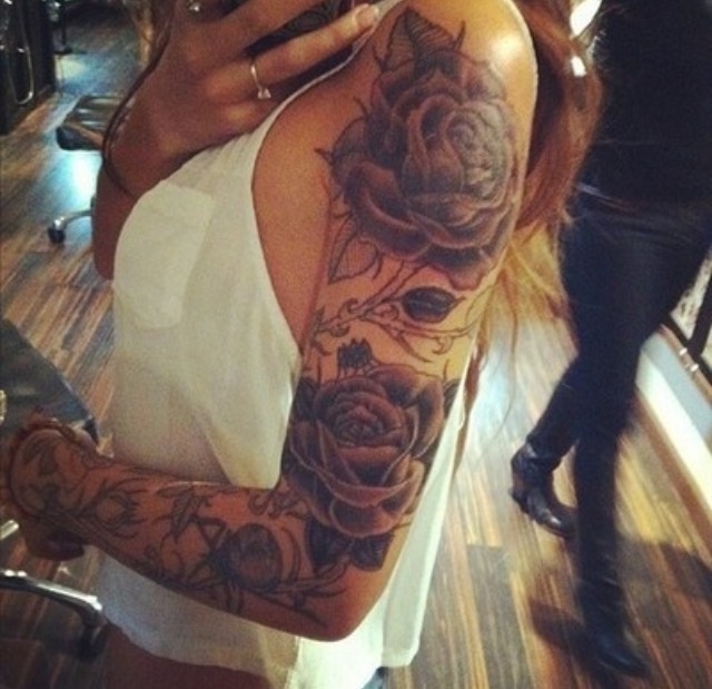 Cute girl rose tattoo on arm