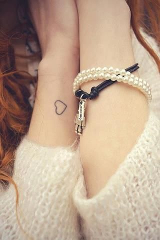 Cute girl’s heart tattoo