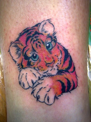 Cute small tiger tattoo on leg