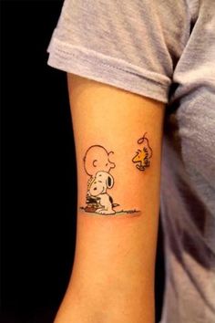 Cute snoopy tattoo on arm