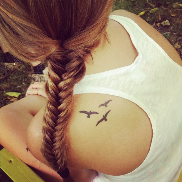 Cute women bird tattoo on shoulder