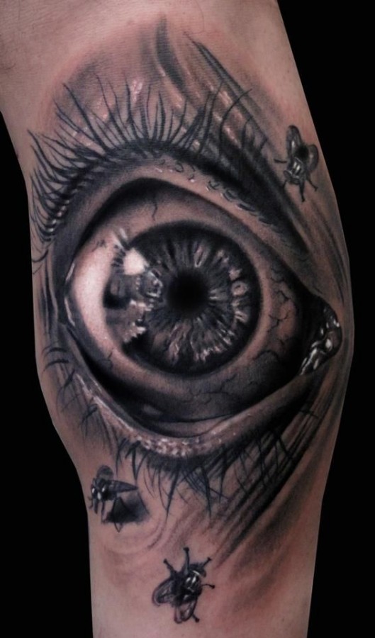 Eye and insect’s ornaments tattoo