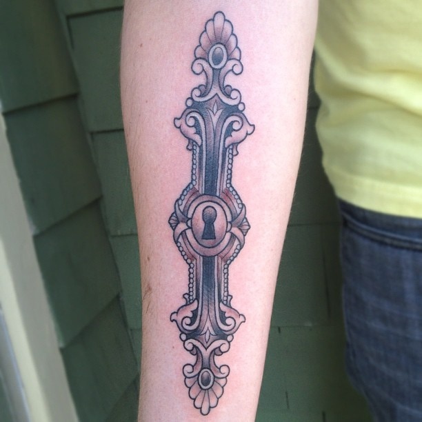 Fancy black keyhole tattoo