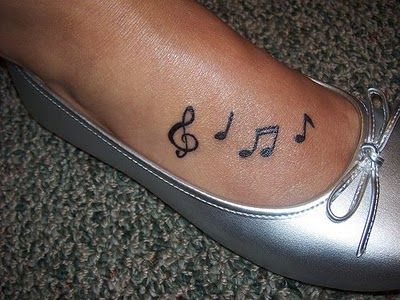 Feel the music star tattoo on leg