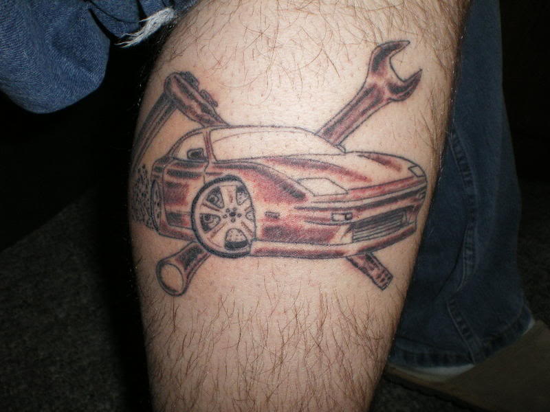 First life car tattoo on leg