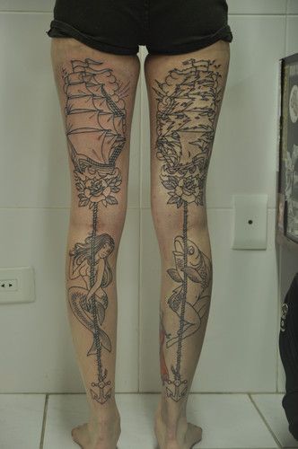 Fish, women and ship tattoo on leg