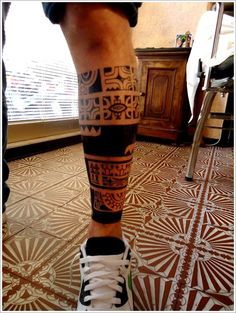 Funny black tribal tattoo on leg