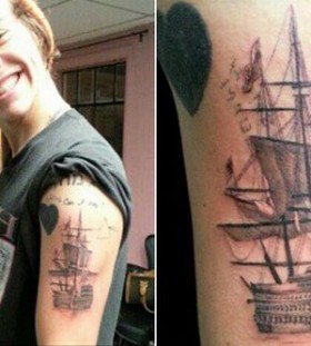 Funny boy's ship tattoo on arm
