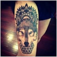 Geometric black wolf tattoo on leg