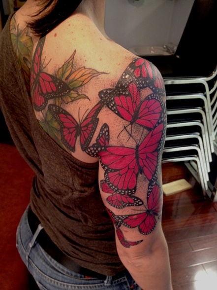 Girl shoulder and arm red butterfly tattooo