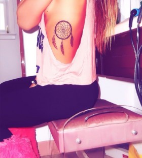 Girl with dream catcher tattoo