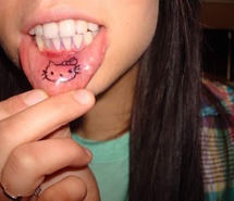 Girl's cat lips tattoo