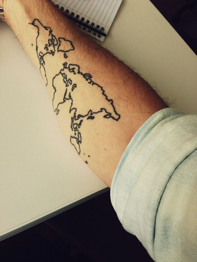 Globe tattoo on arm