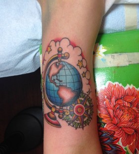 Globe tattoo with compass
